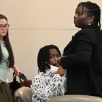 Kwentell Moultrie today, flanked by his attorneys, Assistant Public Defender Regina Nunnally, right, and Assistant Public Defender Alexis Nava-Martinez. (© FlaglerLive)