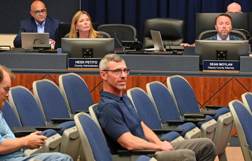 Deputy County Attorney Sean Moylan, right, at an April meeting of the County Commission. (© FlaglerLive)