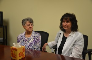 Dana Mulhall's mother Angela Mulhall, left, and Dana's sister Karen Mulhall Theriault, who made generous use of the kleenex box as they reflected on the week-long trial after it concluded today, and remembered Dana. Click on the image for larger view. (© FlaglerLive)