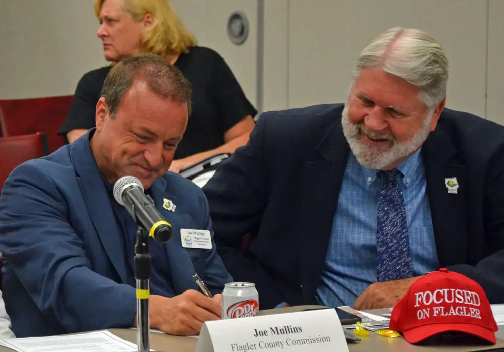 County Commissioner Joe Mullins, left, and County Administrator Jerry Cameron made a land deal focused on St. Johns County. (© FlaglerLive)