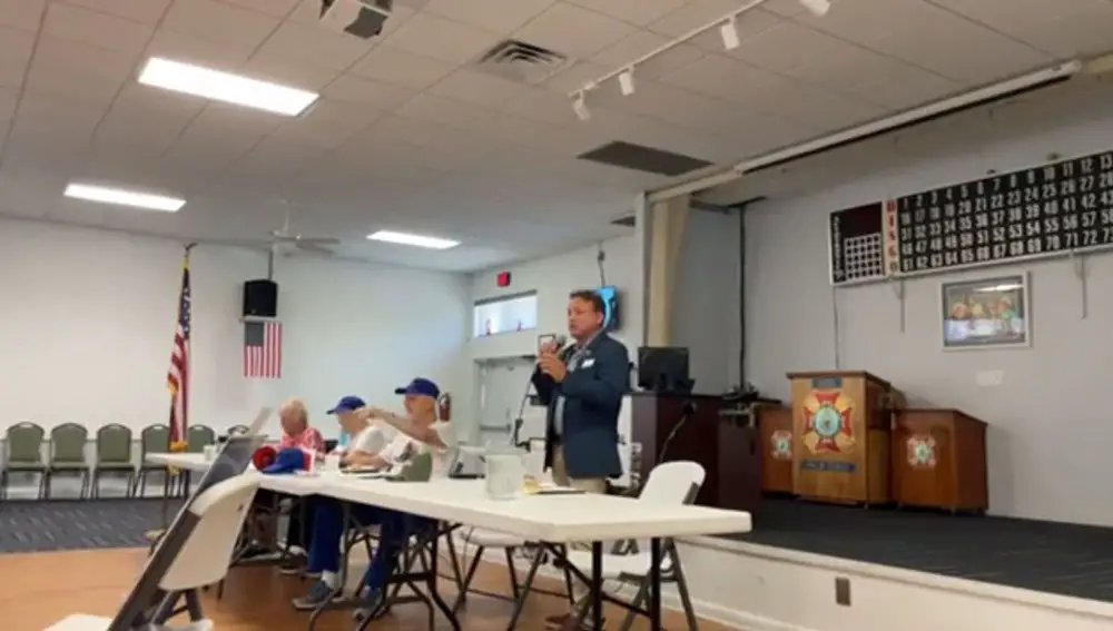 Joe Mullins speaking to a group he calls the 'adorable deplorables,' in a still from the video he'd posted, then taken down, at his Facebook page. 