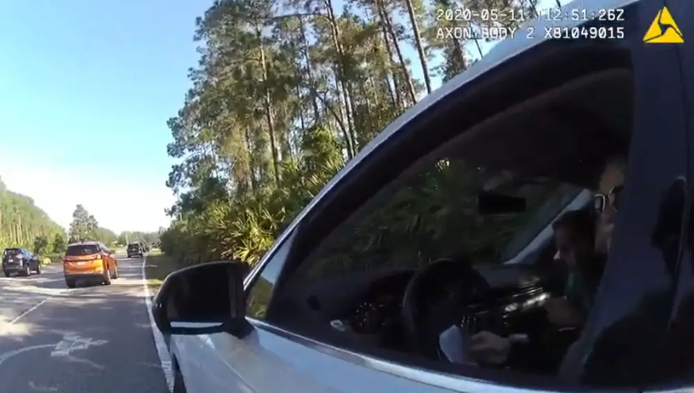 Though he was a passenger, Flagler County Commissioner Joe Mullins almost immediately identified himself as "Joe Mullins" to a sheriff's deputy when pulled over last week on Belle Terre Parkway, then invoked the name of Sheriff Rick Staly. (© FlaglerLive via FCSO bodycam video)