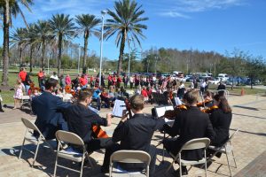 Performances by the student-musicians of the Flagler Youth Orchestra accompany the ceremony. (© FlaglerLive)