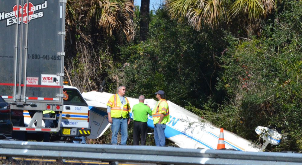 The Cessna that crashed on I-95 this afternoon rolled over into the shoulder on the side of the highway. It is is registered to a Port Orange owner. (© FlaglerLive)