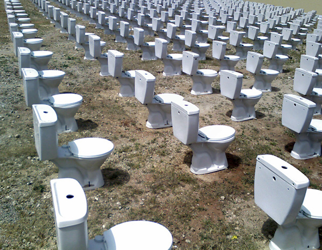 Detail from a 2008 installation by artist Nada Sehnaoui in Beirut. toilets and toilet seats. Drug testing. (Blogging Beirut)