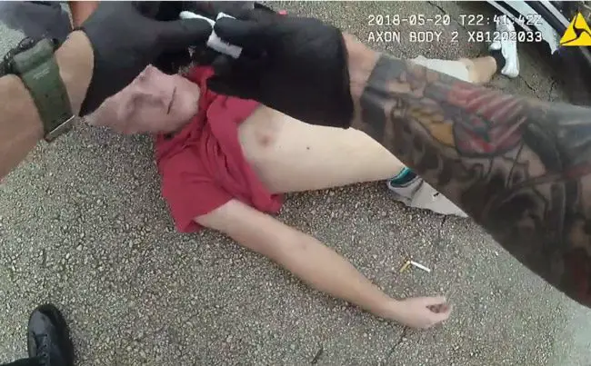 Ryan Walker, unresponsive from a heroin overdose, moments before getting a dose of Narcan that helped revive him. (© FlaglerLive via FCSO video)
