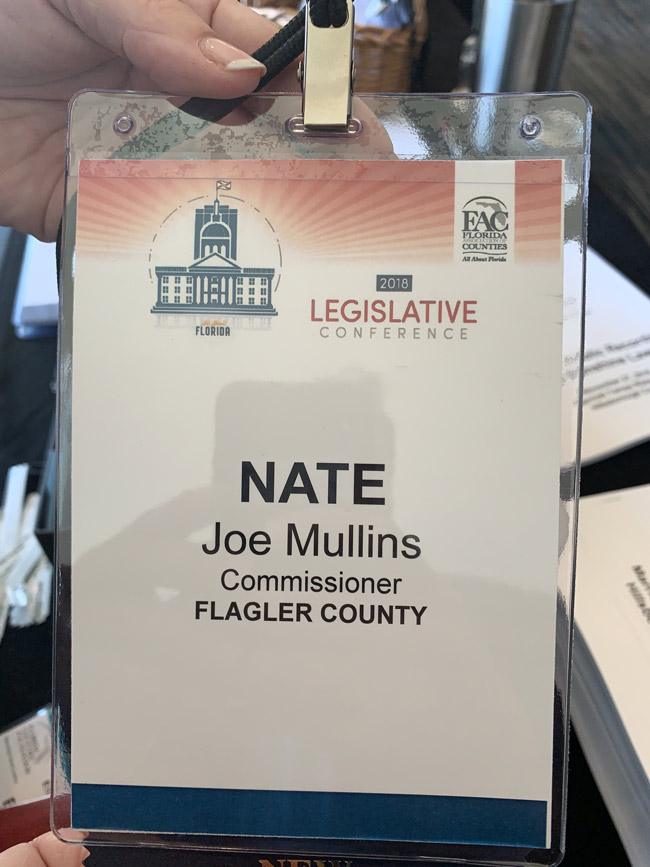 Newly-elected Flagler County Commissioner Joe Mullins is attending the Florida Association of Counties' Legislative Conference in Tampa this week. But he had a surprise when he went to pick up his name badge: organizers had his name in second billing, below 'Nate,' former Commissioner Nate McLaughlin, whom Mullins defeated. 'I just can't win,' Mullins joked in a text. 'You think someone is trying to set me off.' He added: 'Things like this don;t bother me, they make for funny stories.' On Tuesday, he'd been attending a seminar on ethics, public records and Sunshine laws.