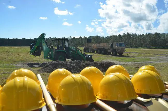 The National Guard broke ground at a 34-acre site at the south end of the Flagler County Airport Friday, 16 years after first considering the project. (© FlaglerLive)