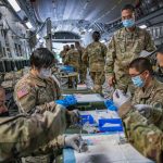 What they're fighting for: members of the Hawaii National Guard preparing covid vaccines. (National Guard)