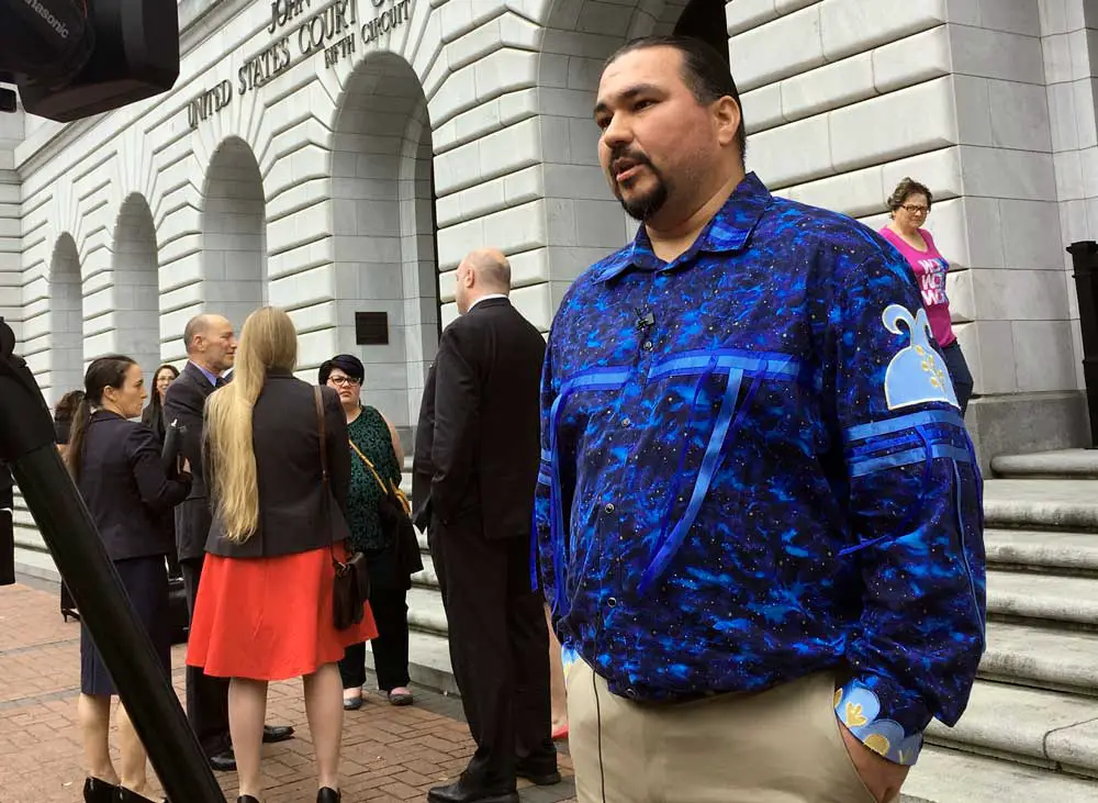Tehassi Hill, tribal chairman of the Oneida Nation, stands outside a U.S. appeals court in 2019 after arguments in case that has made its way to the Supreme Court. (AP Photo/Kevin McGill)