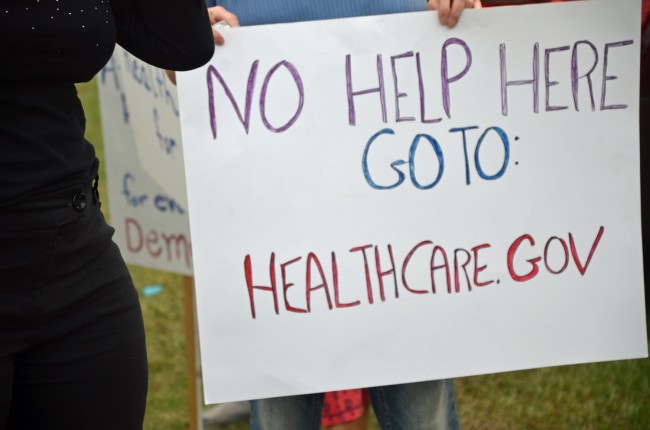 A sign directed at the local health department, where federal 'navigators' meant to help people enroll in insurance plans are prohibited. Click on the image for larger view. (© FlaglerLive)