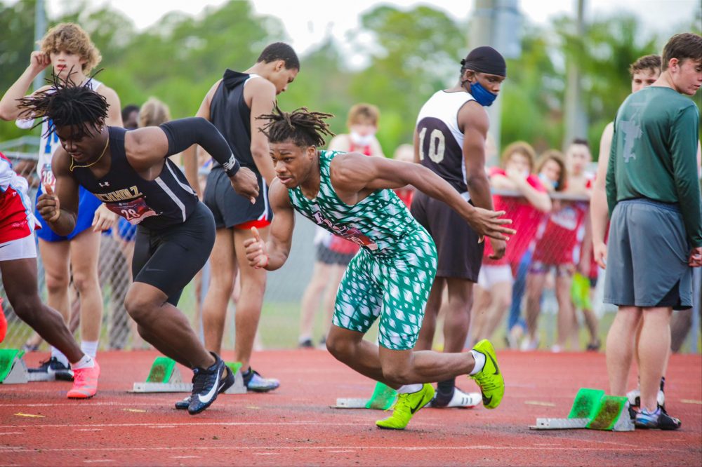 Nehemiah Gilyard, center, was on Flagler Palm Coast High School's track and football teams for three years. (Cady Studios)