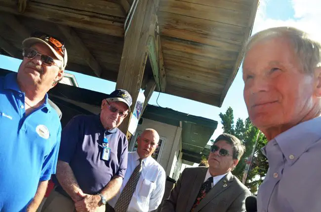 A jubilant Sen. Nelson announcing the news of the congressional authorization for renourishment of Flagler's beaches at the Flagler Beach Pier Monday, in front of, from left, Flagler Beach City Commissioner Rick Belhumeur, and County Commissioners Dave Sullivan, Donald O'Brien and Commission Chairman Nate McLaughlin. (© FlaglerLive)