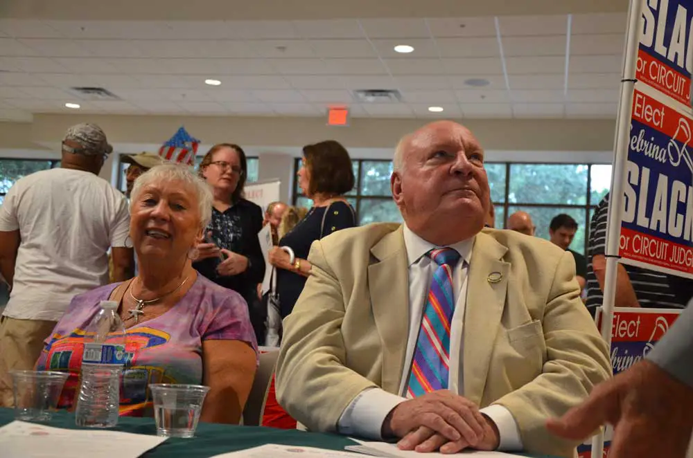 Jon Netts with his wife Priscilla Netts when he was running for a council seat in July 2018, in an event at the Palm Coast Community Center that may soon bear his name. (© FlaglerLive)