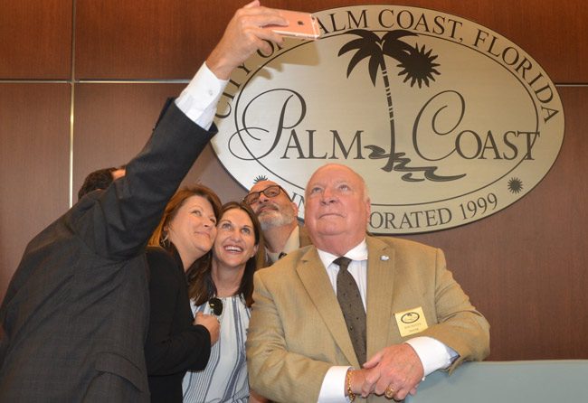 Foroemr council member and mayor Jon Netts, right, may want to be in the picture again alongside Steven Nobile and current mayor Milissa Holland, but Heidi Shipley, fourth from left, is calling it quits at the end of her one term. (© FlaglerLive)