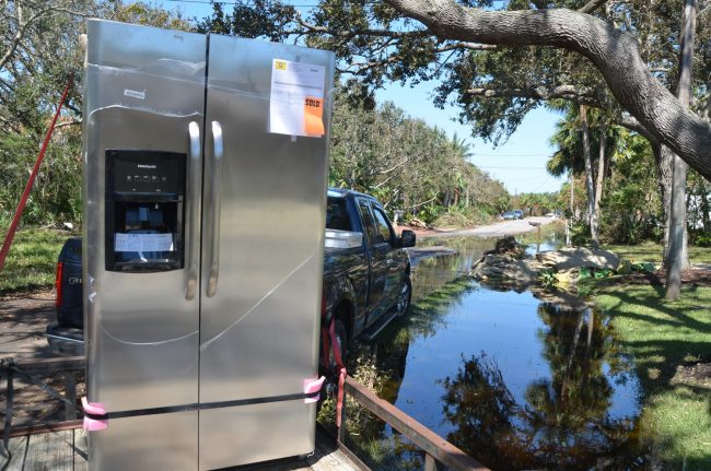 A new fridge was atFlagler Beach City Commissioner Rick Belhumeur's house this morning, replacing one destroyed by the flood. Click on the image for larger view. (c FlaglerLive)