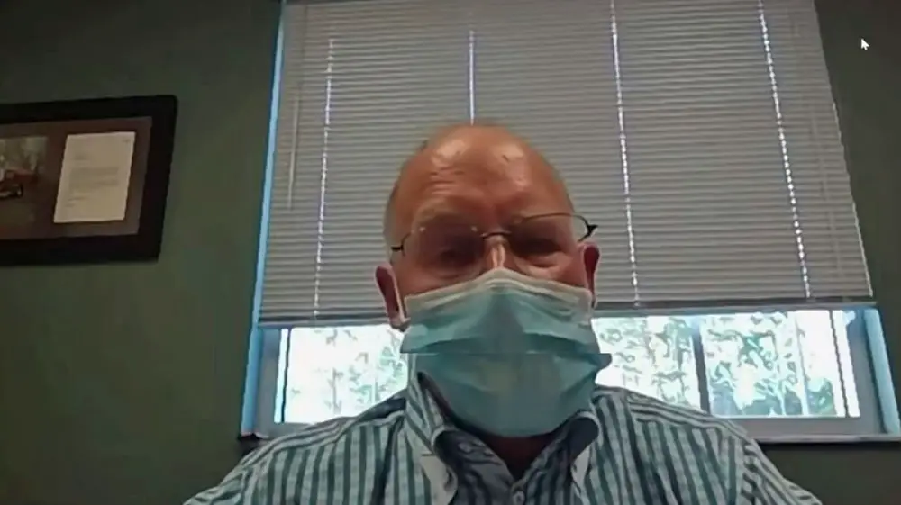 Flagler Health Department Director Bob Snyder in face mask, addressing the Palm Coast City Council during a  virtual meeting last week. (© FlaglerLive via YouTube)