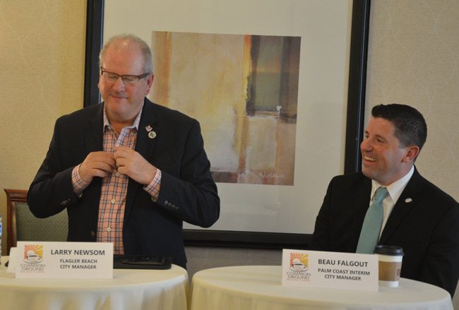 Flagler Beach City Manager Larry Newsom, standing, and Palm Coast Interim Manager Beau Falgout frequently stole the show with their humor at this morning's Common Ground breakfast organized by the Flagler Chamber of Commerce at the Palm Coast Hilton. (© FlaglerLive)