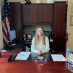 Kadance Nickmeyer, a student at Matanzas High School, at Sheriff Rick Staly's desk after winning an essay contest that meant spending the day with the sheriff. (FCSO)