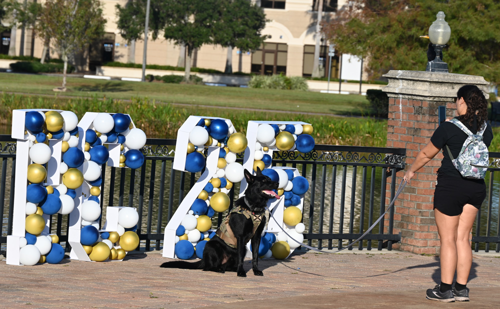 Michelle Young and her dog Nitro memorialize the occasion. (© FlaglerLive)