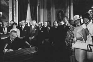 Lyndon Johnson signs the act. 