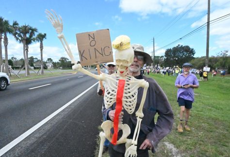 A protester on No Kings Day in palm Coast on Oct. 18. (© FlaglerLive)