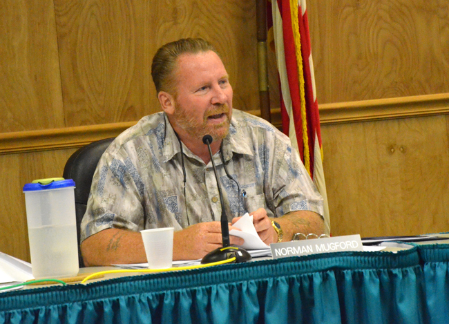 Code enforcement power: Norman Mugford, a member of Palm Coast's code enforcement board, speaking about the pain of solicitors--and the city's and the sheriff's office's inaction, at a meeting in early July. Both have since responded, jailing unlicensed solicitors. (© FlaglerLive)