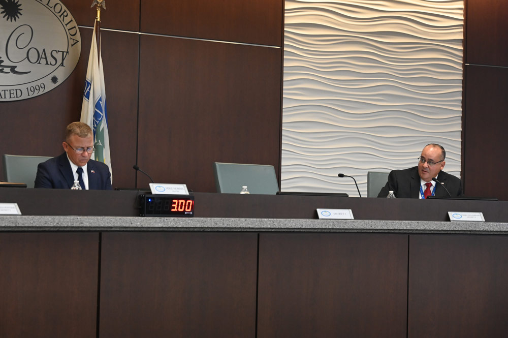 Palm Coast Mayor Mike Norris, left, and Council member Charles Gambaro each wants the other booted off the council. (© FlaglerLive)