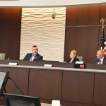 Back in December, Mike Norris would still look occasionally Acting City Manager Lauren Johnston in the eye. (© FlaglerLive)