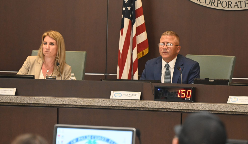 Palm Coast Mayor Mike Norris has abandoned most of his public responsibilities, forcing his colleagues, especially Council member Theresa Pontieri, the vice mayor, left, to pick up his slack. He is also refusing to get briefed before meetings. (© FlaglerLive)
