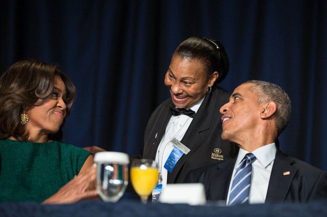 President Barack Obama and Michelle Obama with Hilton banquet server Kitty Casey during the National Prayer Breakfast at the Washington Hilton in Washington, D.C., Feb. 5, 2015. (White House)