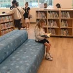 8-year-old Madeleyn O’Brien got right to reading. (© FlaglerLive)