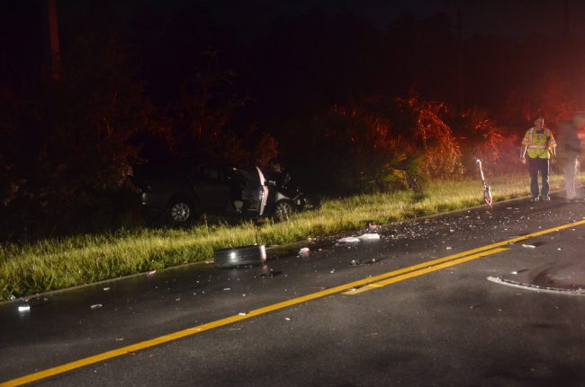 Crash debris on Old Kings Road, near the Corolla. Click on the image for larger view. (© FlaglerLive)