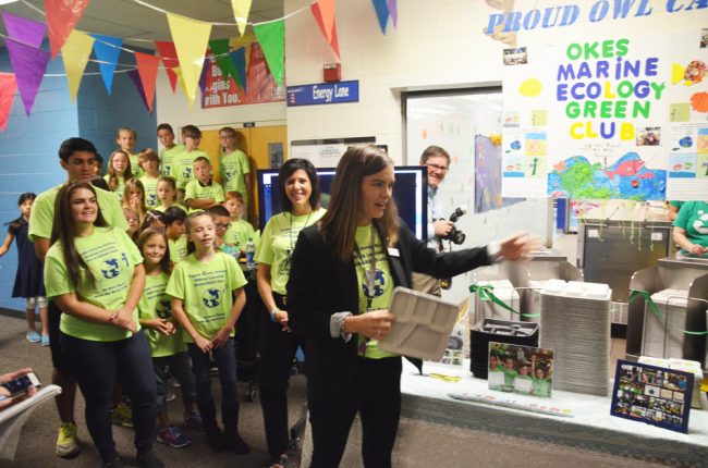 Assistant Principal Kirianne Bird Suriano presenting the new trays in a brief ceremony this morning at Old Kings. Click on the image for larger view. (© FlaglerLive)