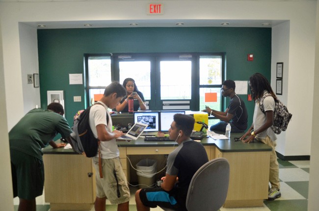 Students, seen here at the Flagler County Youth Center, are never far from their school-issued computers. (c FlaglerLive)