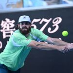 A stretch too far: Reilly Opelka in his third-round loss at the Australian Open today. (Peter Staples/ATPTour.com)