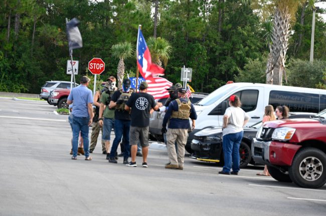 Just before the meeting, in the parking lot. (© FlaglerLive)