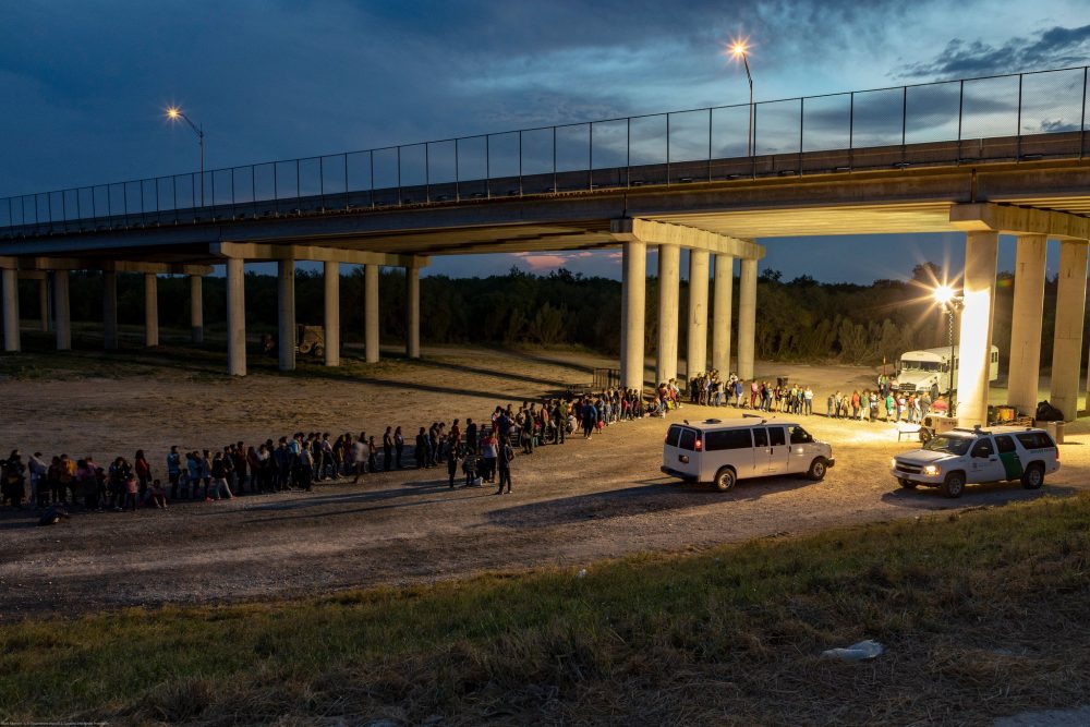 Migrants that have crossed the Rio Grande surrender to U.S. Border Patrol near an area known as Rincon. From here they will be transported to a processing center. (CBP)