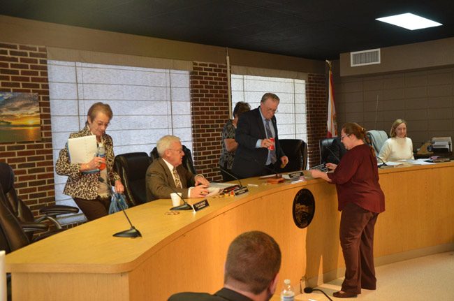 While Flagler Beach City Commission meetings are no longer accessible by streaming on the web, City Clerk Penny Overstreet, second from right, is exploring ways to bring back the videos while also providing close-captioning, which would shield the city from potential lawsuits under the Americans with Disabilities Act. (© FlaglerLive)