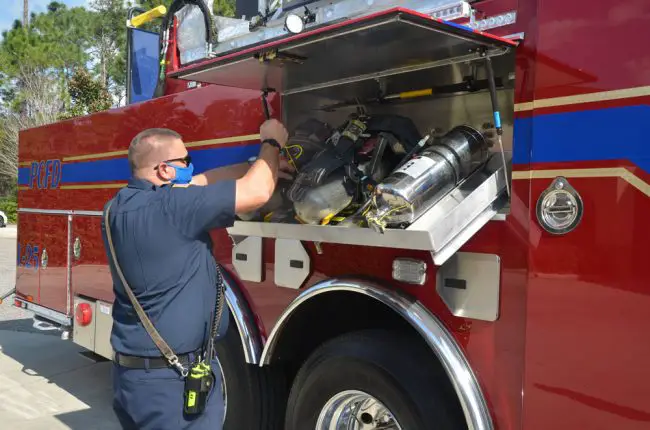 By storing oxygen tanks outside the cab, carcinogenic elements in the firefighters' environment is reduced. (© FlaglerLive)