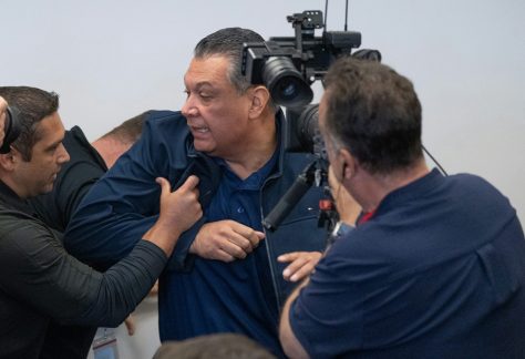 U.S. Sen. Alex Padilla of California is pushed out of the room after he interrupted Homeland Security Secretary Kristi Noem during a news conference in Los Angeles on June 12, 2025.
