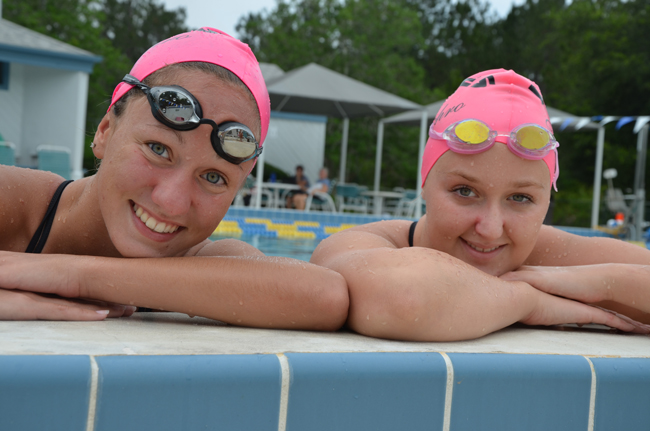 Paige Wells, left, and Melanie Watkins are graduating high school and the Synchro Belles program and will be joining synchronized swimming teams in college: the top-ranked Ohio State Buckeyes for Wells, the Gators for Watkins. (© FlaglerLive)