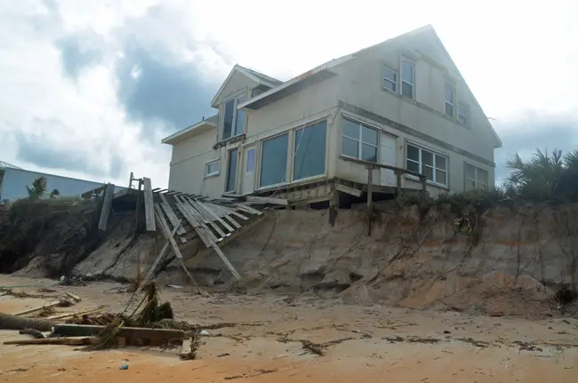 One of the houses more severely affected by erosion following Hurricane Matthew. It's among the houses getting a seawall soon. (© FlaglerLive)