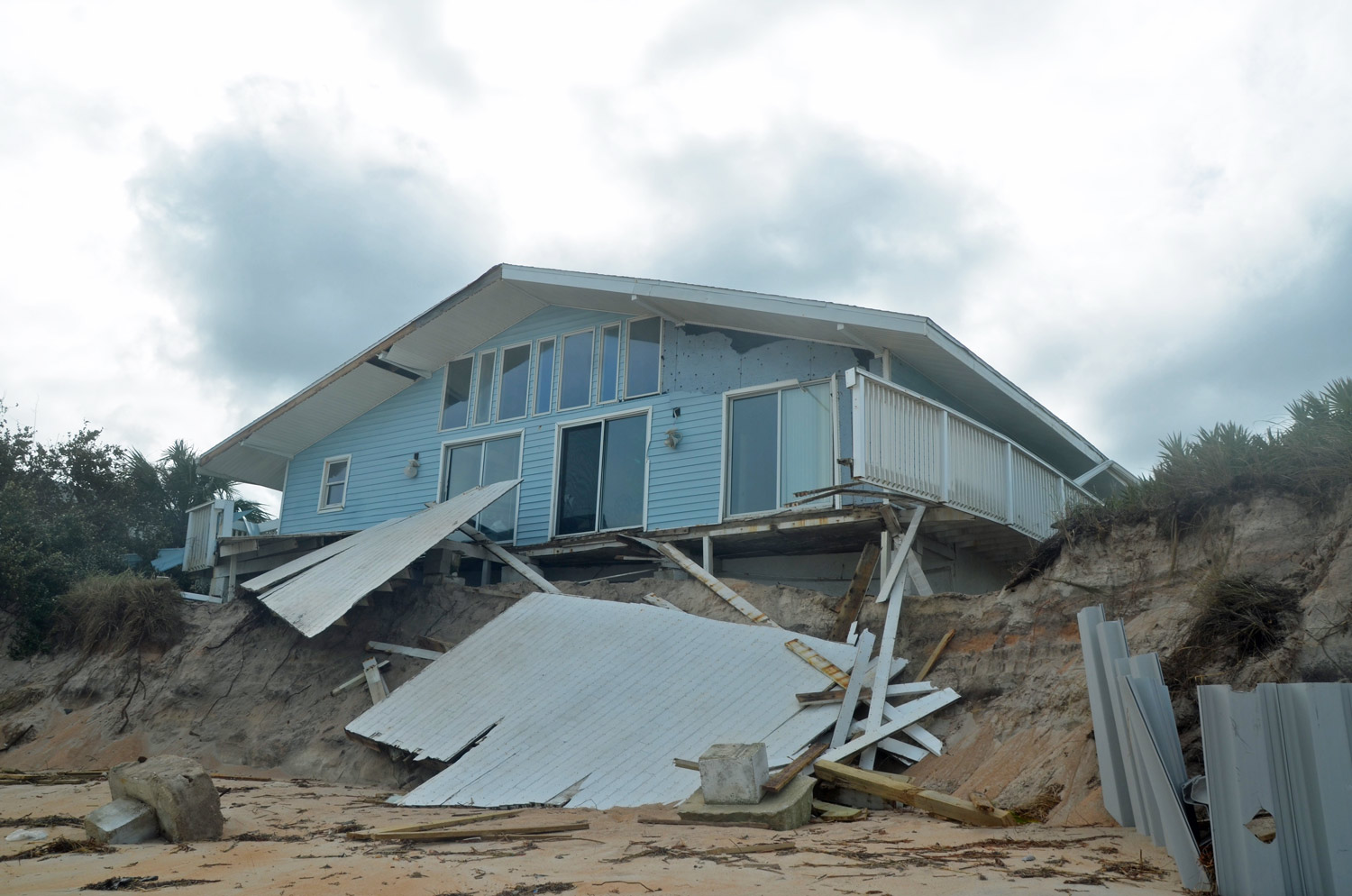 One of the more heavily damaged houses on Painters Hill, just south of Varn Park, in unincorporated Flagler County, as seen from the ocean. Click on the image for larger view. (© FlaglerLive)