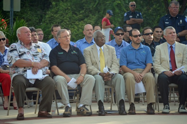 It's up to them now. Members of the Palm Coast City Council at a July 4 ceremony. From left, Mayor Jon Netts and council members Bill McGuire, Bill Lewis, Jason DeLorenzo and David Ferguson. Click on the image for larger view. (© FlaglerLive)