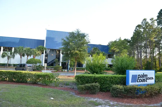 The 70,000 square foot building that had been Palm Coast City Hall until 2008 was leased to Palm Coast Data for $240,000 a year before the city sold it outright for a relative pittance of $3 million as part of an economic development incentive deal, one of the city's lesser successes, as the company has shed jobs for most of the decade and struggled to maintain its hold in the subscription fulfillment industry. (© FlaglerLive)