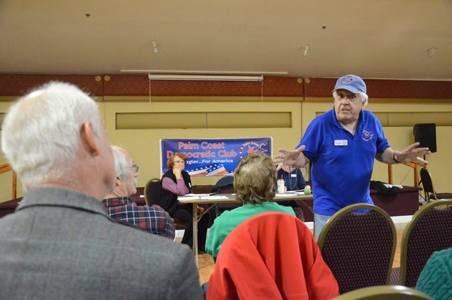 Palm Coast Democratic Club President Mike Cocchiola in full form at a monthly meeting of the club Thursday evening at the African American Cultural Society, where the club heard from congressional candidate Bob Coffman (in the foreground to the left). 'This is the year we're not going to fool around,' Cocchiola said. 