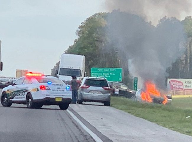 The fire engulfed a Toyota Camry after the collision at mile marker 296 on I-95, just south of the Flagler-St. Johns county line Sunday evening. (Matthew Heather)