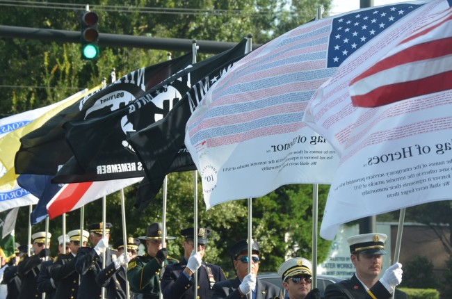 The Parade of Flags at this mornings 9/11 ceremony at Palm Coast's Heroes Park includes the flags of first responders in Flagler and New York. Click on the image for larger view. (© FlaglerLive)