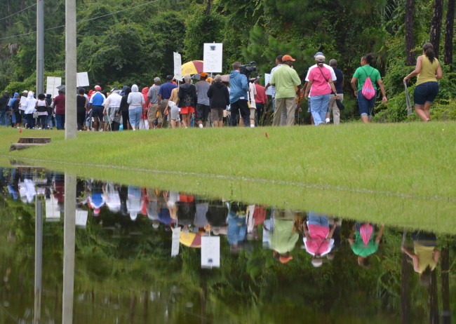 Most of the marchers in Saturday's demonstration down Palm Coast Parkway either participated in or remember the civil rights years firsthand. Click on the image for larger view. (© FlaglerLive)